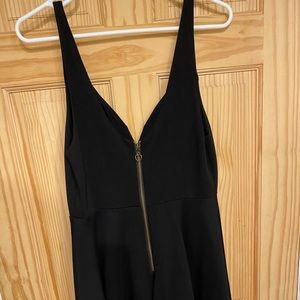 This dress has a hardwire heart shaped v neck in the front & back. Bottom flare